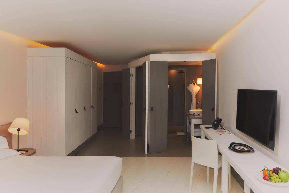 Télévision ou salle de divertissement dans l'établissement Hôtel Plage Palace & Spa