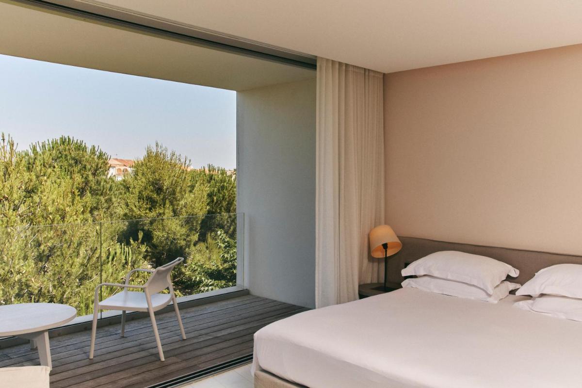 Un ou plusieurs lits dans un hébergement de l'établissement Hôtel Plage Palace & Spa