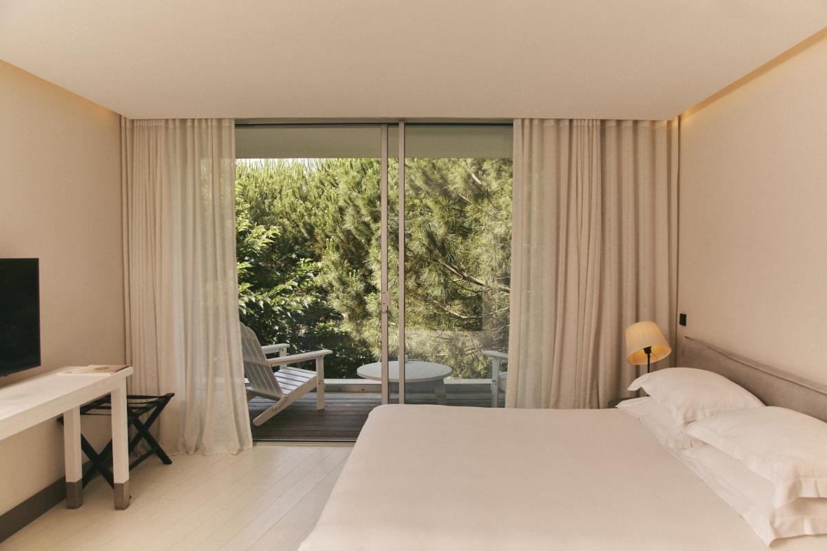 Un ou plusieurs lits dans un hébergement de l'établissement Hôtel Plage Palace & Spa