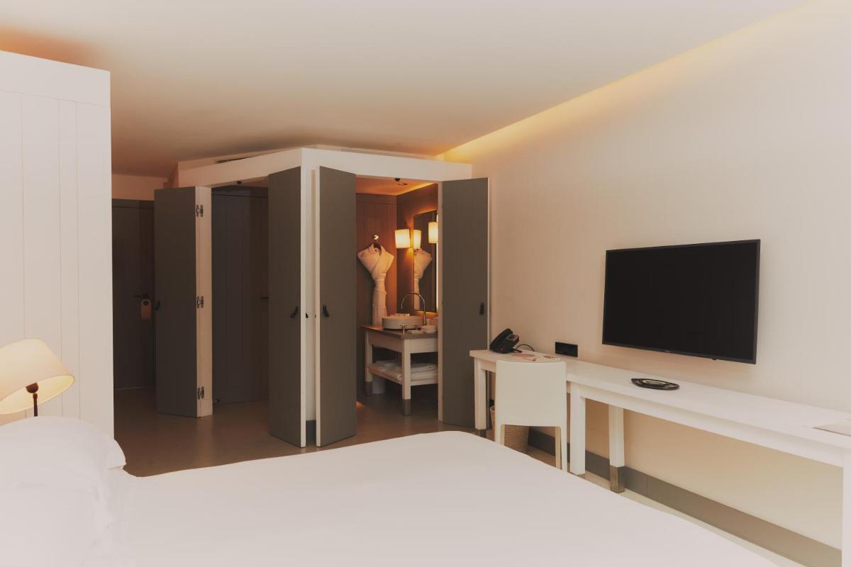 Télévision ou salle de divertissement dans l'établissement Hôtel Plage Palace & Spa