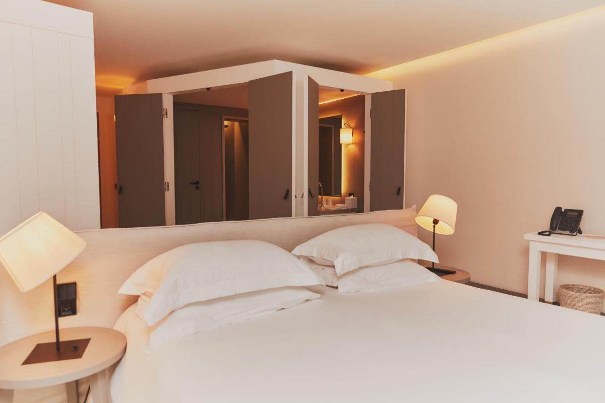 Un ou plusieurs lits dans un hébergement de l'établissement Hôtel Plage Palace & Spa