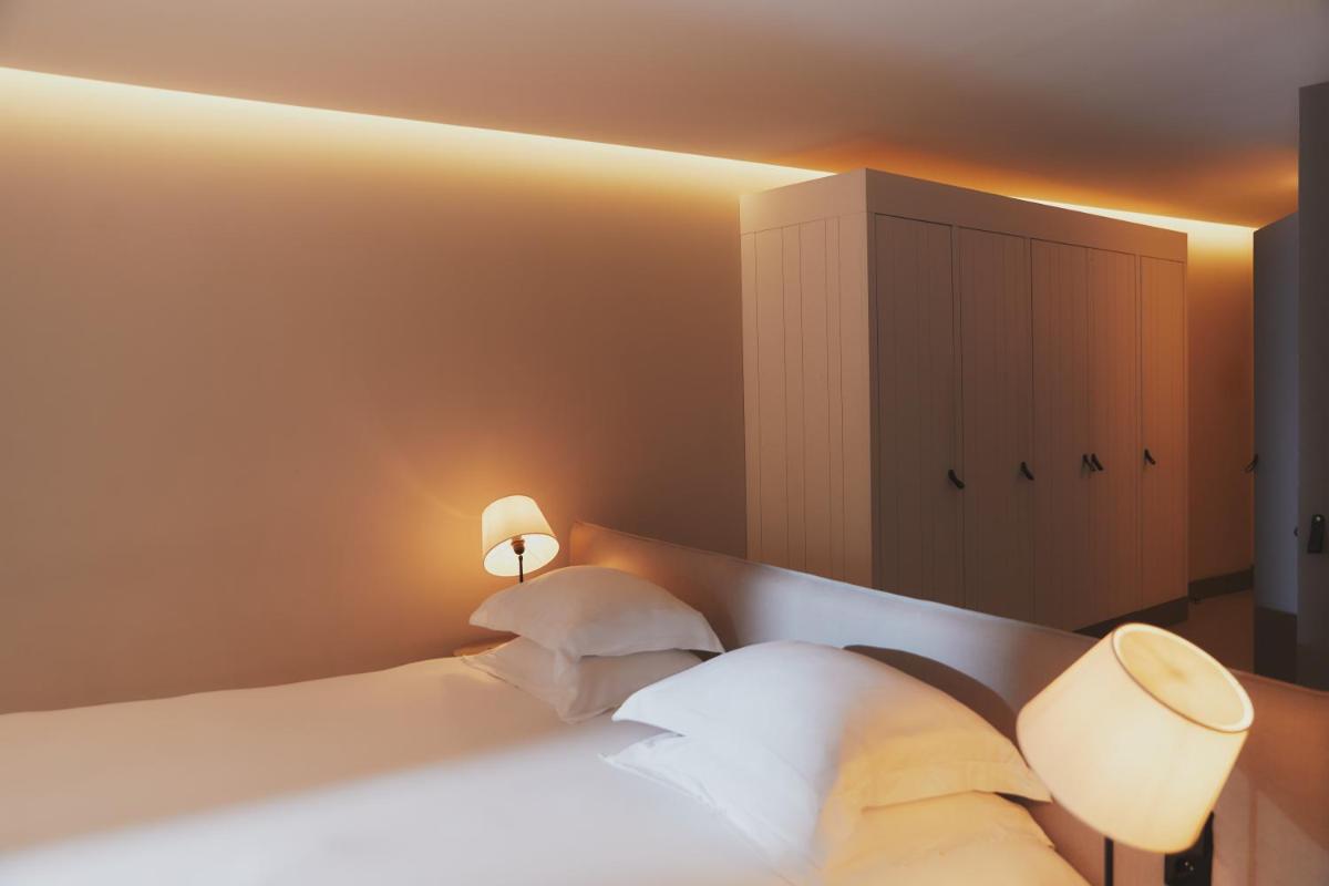 Un ou plusieurs lits dans un hébergement de l'établissement Hôtel Plage Palace & Spa