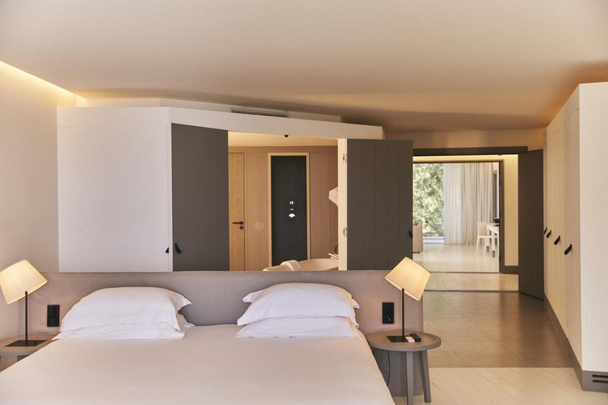Un ou plusieurs lits dans un hébergement de l'établissement Hôtel Plage Palace & Spa
