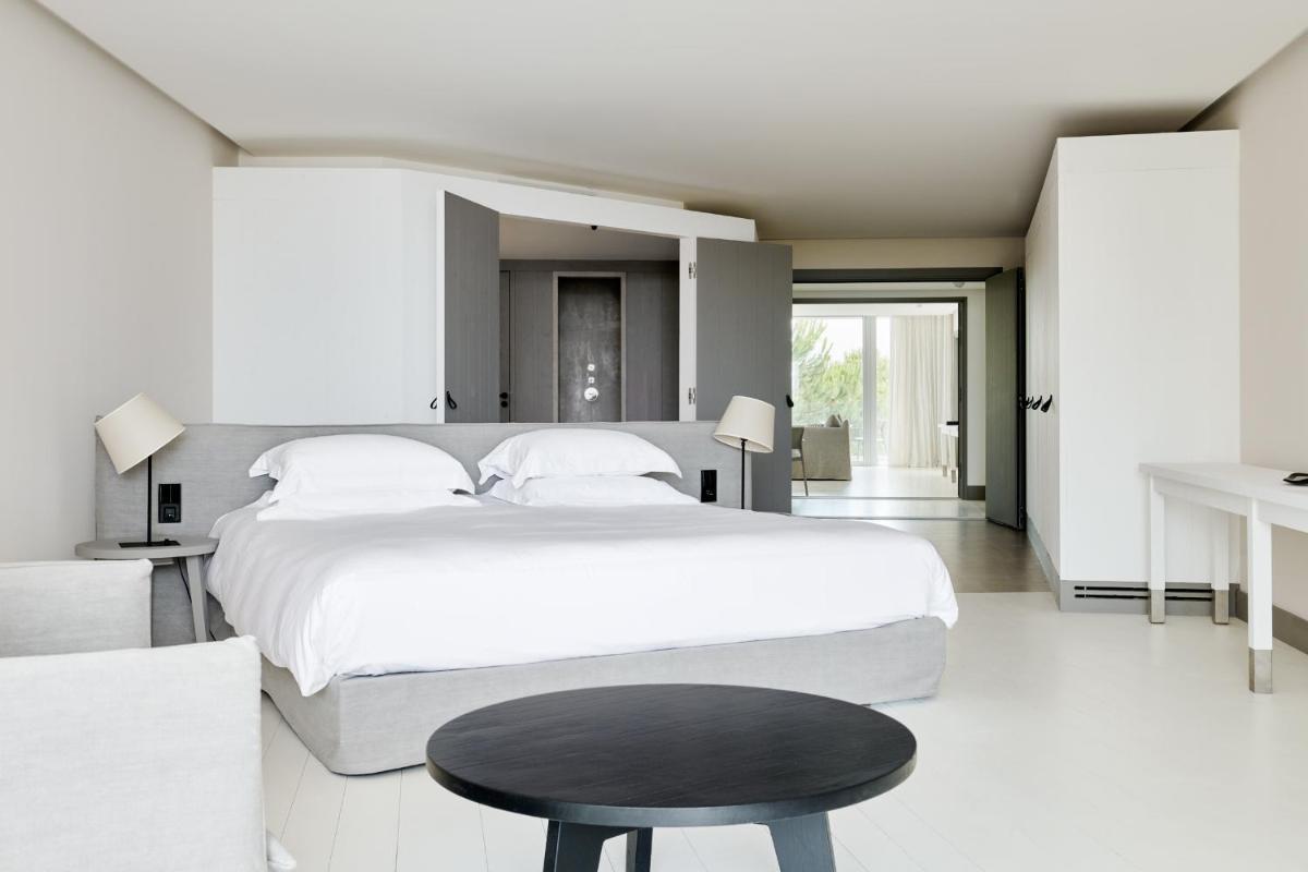 Un ou plusieurs lits dans un hébergement de l'établissement Hôtel Plage Palace & Spa