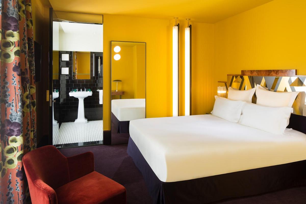 Un ou plusieurs lits dans un hébergement de l'établissement Hôtel Saint-Marc