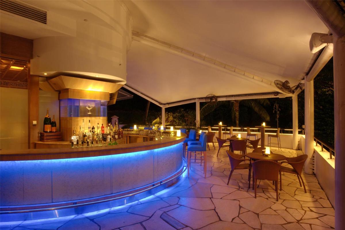 a bar with blue lighting in a restaurant at Shangri-La Rasa Sentosa, Singapore in Singapore