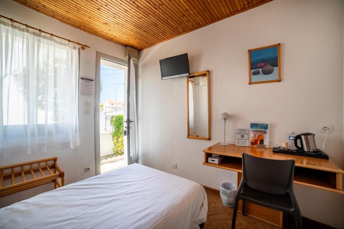 Un ou plusieurs lits dans un hébergement de l'établissement Hotel Les Dunes