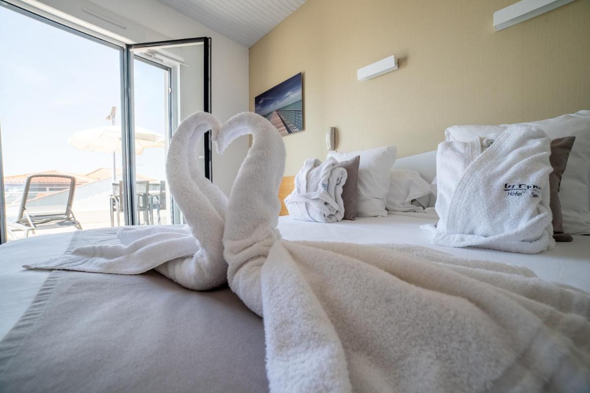 Un ou plusieurs lits dans un hébergement de l'établissement Hotel Les Dunes