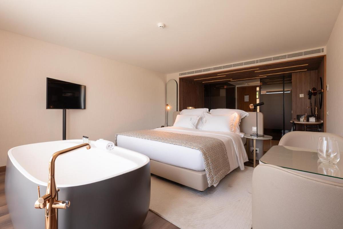 Uma cama ou camas num quarto em Quinta da Maquia Hotel
