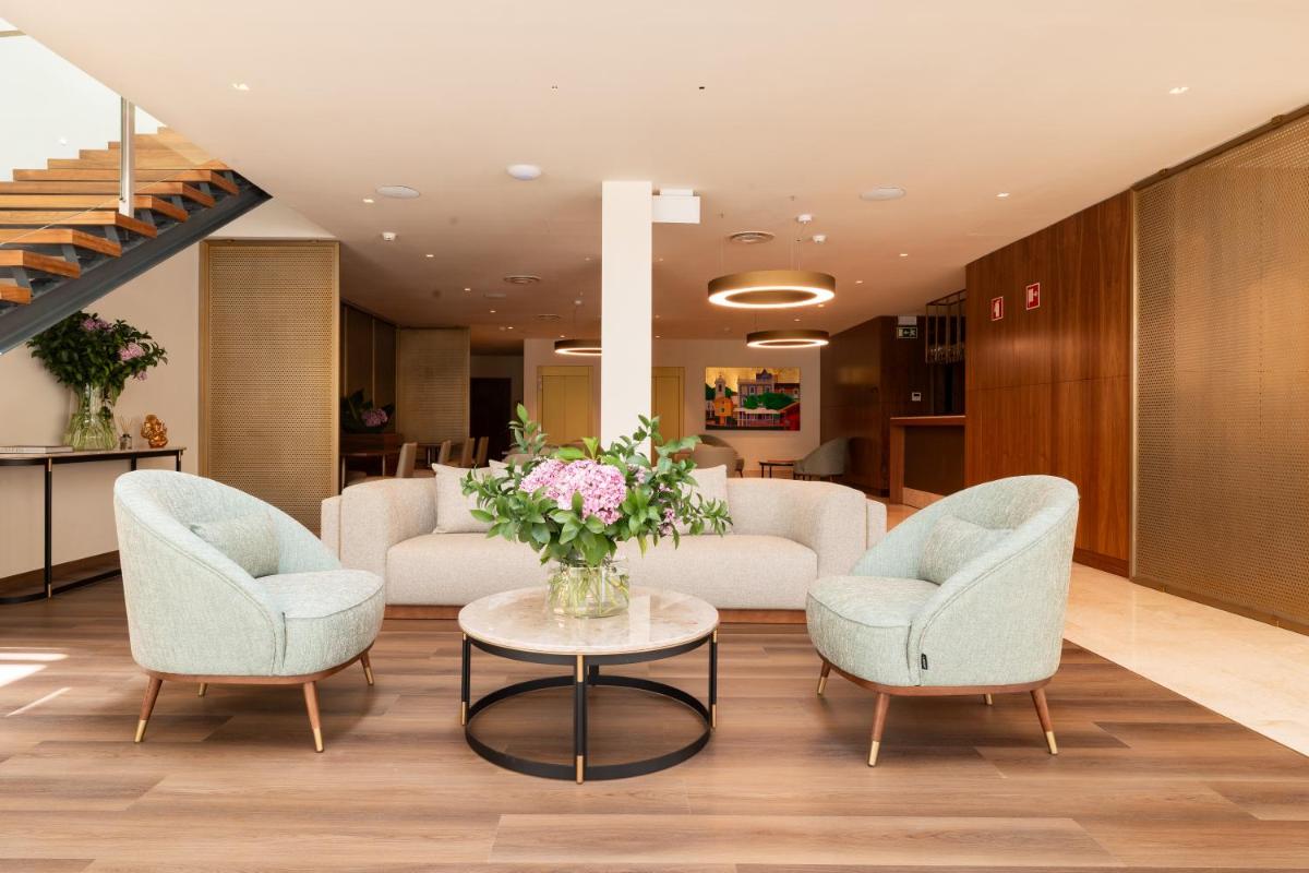 Uma área de estar em Quinta da Maquia Hotel