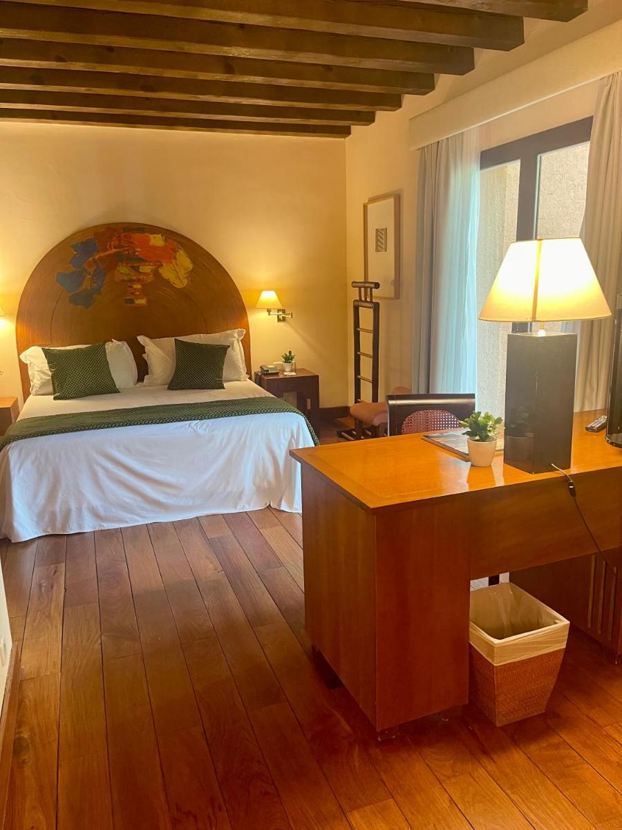 Cama o camas de una habitación en Hotel El Rancho