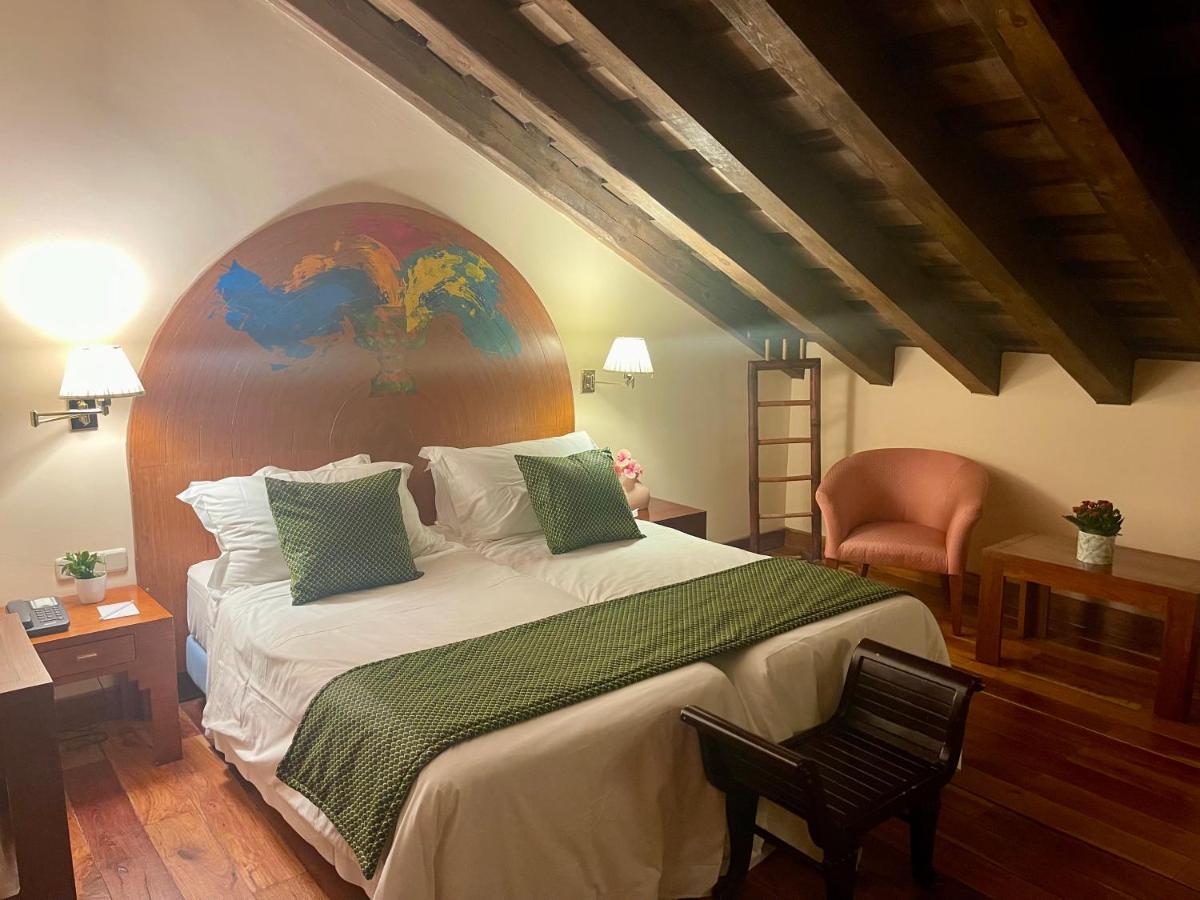 Cama o camas de una habitación en Hotel El Rancho