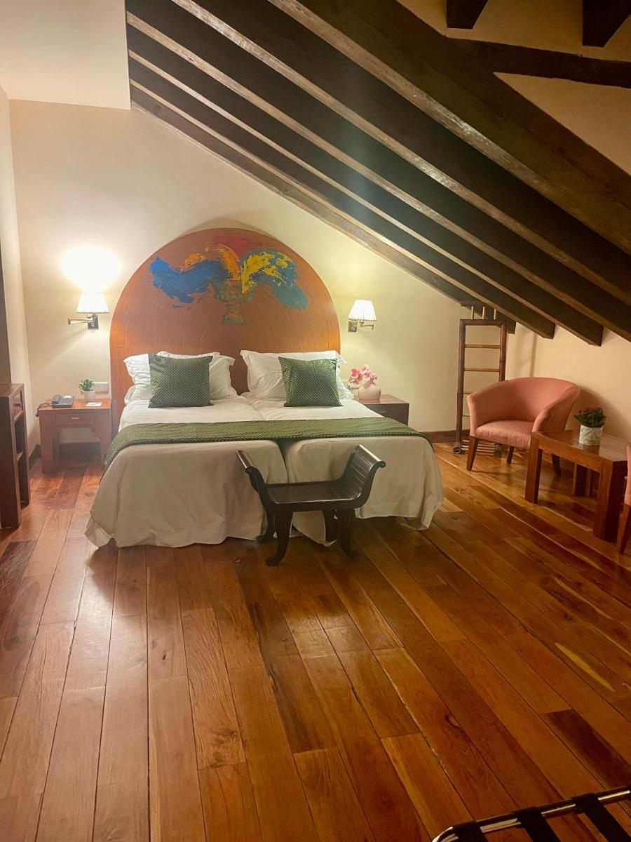 Cama o camas de una habitación en Hotel El Rancho