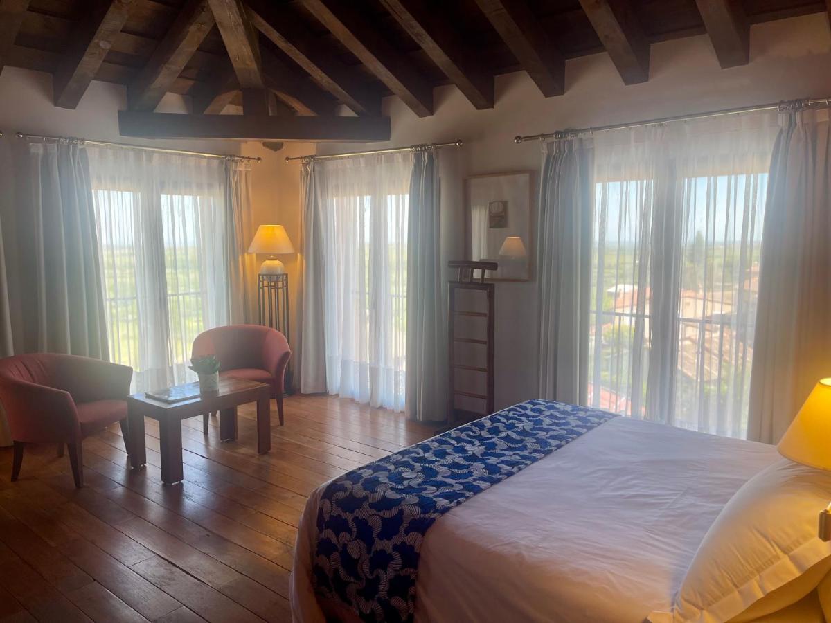 Cama o camas de una habitación en Hotel El Rancho