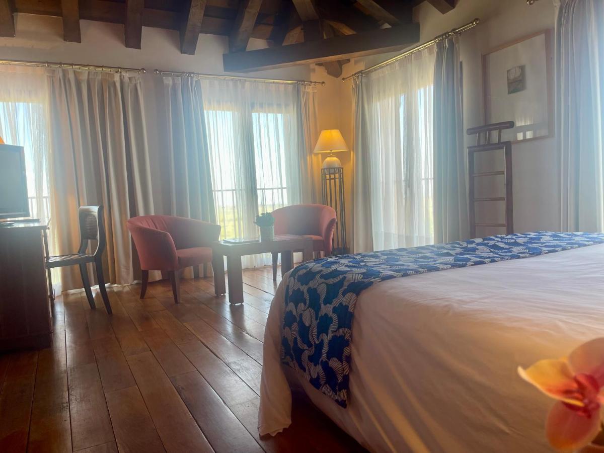 Cama o camas de una habitación en Hotel El Rancho