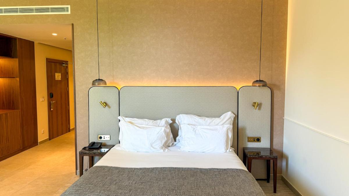 Uma cama ou camas num quarto em AP Lago Montargil - Conference & SPA