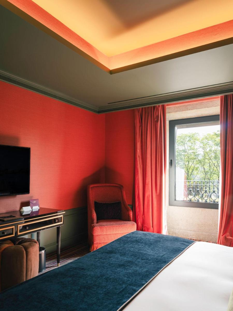 Uma televisão e/ou sistema de entretenimento em Vinha Boutique Hotel - The Leading Hotels of the World