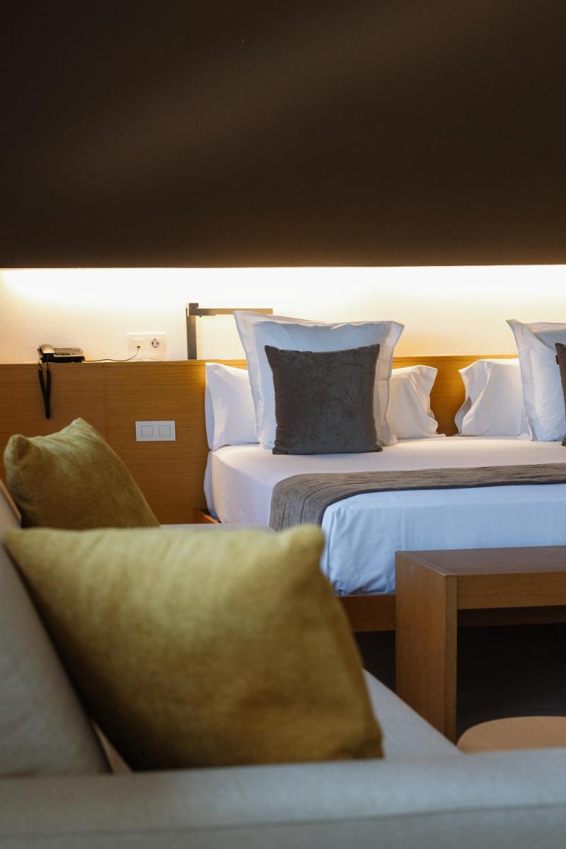 Cama o camas de una habitación en URH - Hotel Molí del Mig