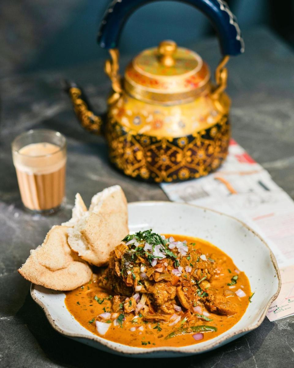a bowl of soup with bread and a teapot at Hyatt Centric Candolim Goa in Calangute a bowl of soup with bread and a teapot at Hyatt Centric Candolim Goa in Calangute