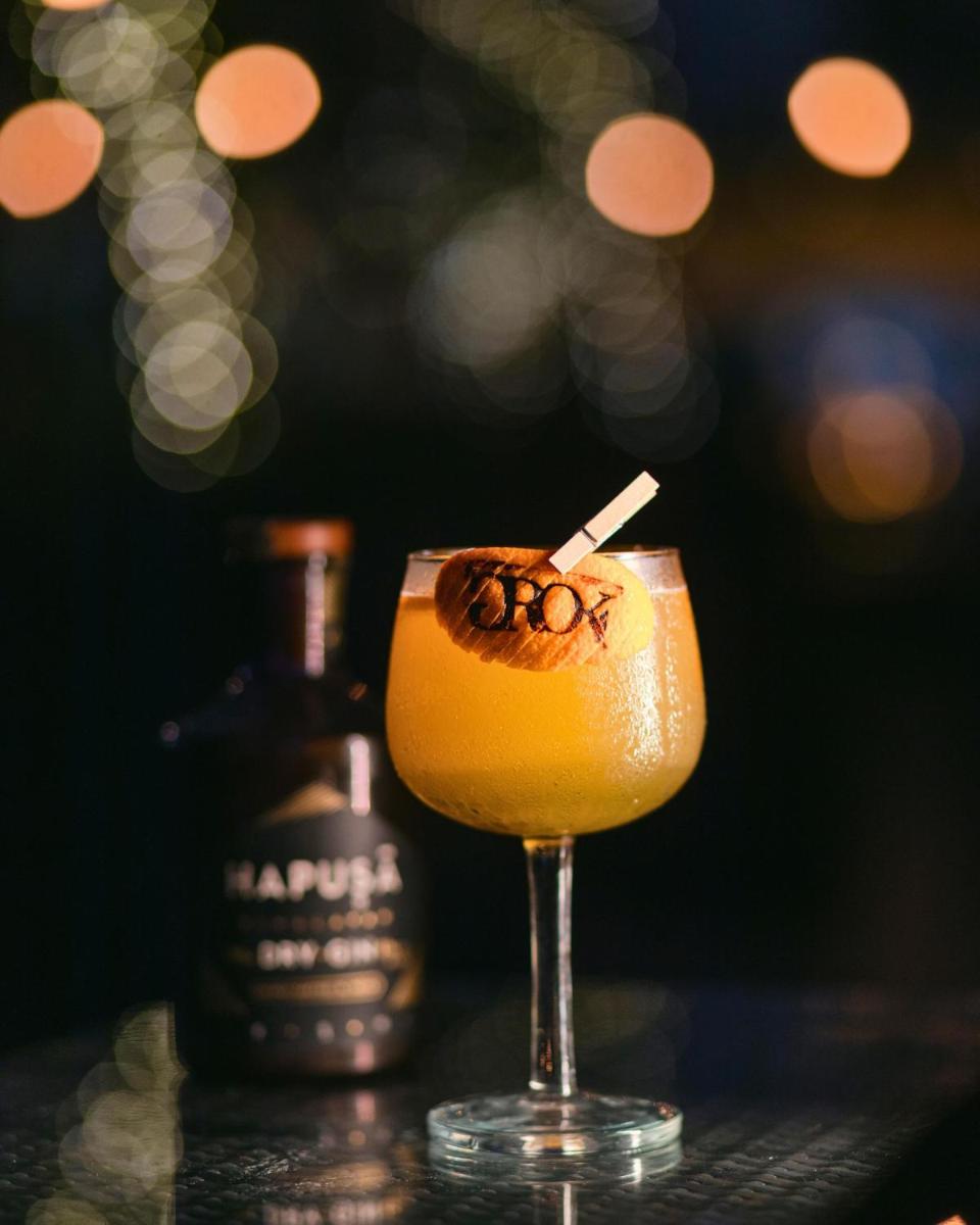 a drink with a straw in a glass on a table at Hyatt Centric Candolim Goa in Calangute a drink with a straw in a glass on a table at Hyatt Centric Candolim Goa in Calangute