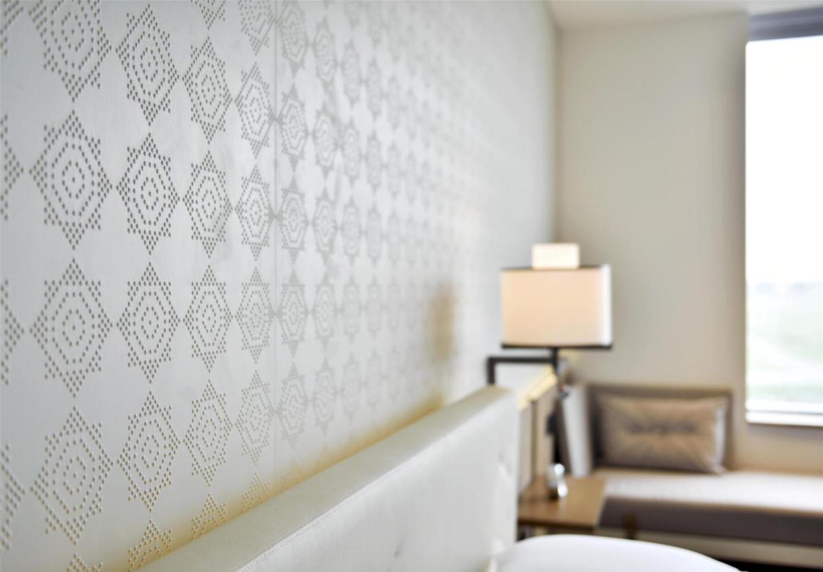 a living room with a couch and a table at Andaz Delhi, by Hyatt in New Delhi a living room with a couch and a table at Andaz Delhi, by Hyatt in New Delhi