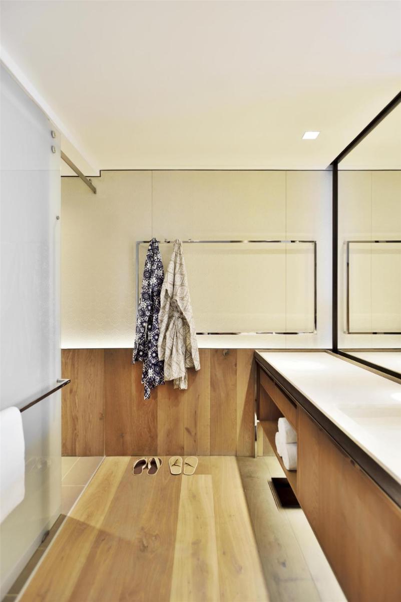 a kitchen with white counters and wooden floors at Andaz Delhi, by Hyatt in New Delhi a kitchen with white counters and wooden floors at Andaz Delhi, by Hyatt in New Delhi