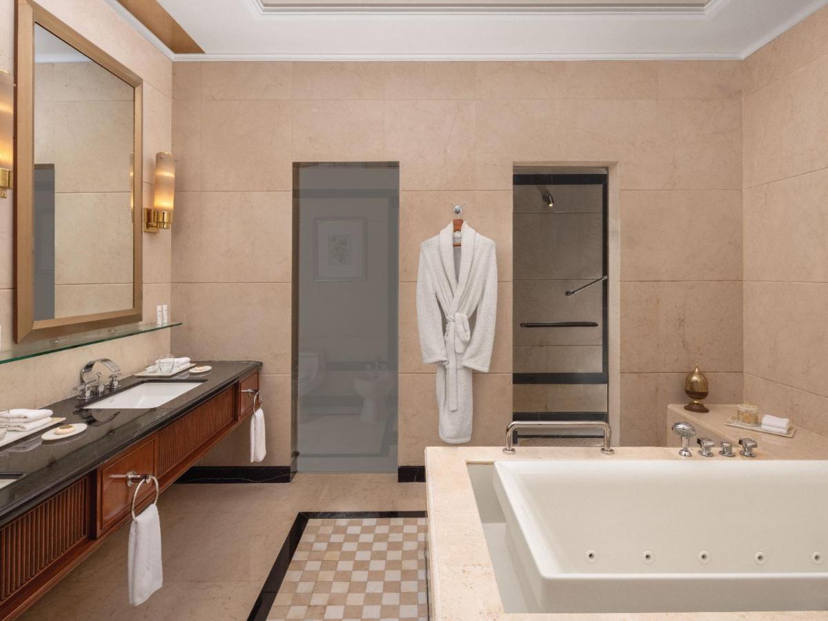 a bathroom with a tub and a sink at ITC Grand Central, a Luxury Collection Hotel, Mumbai in Mumbai