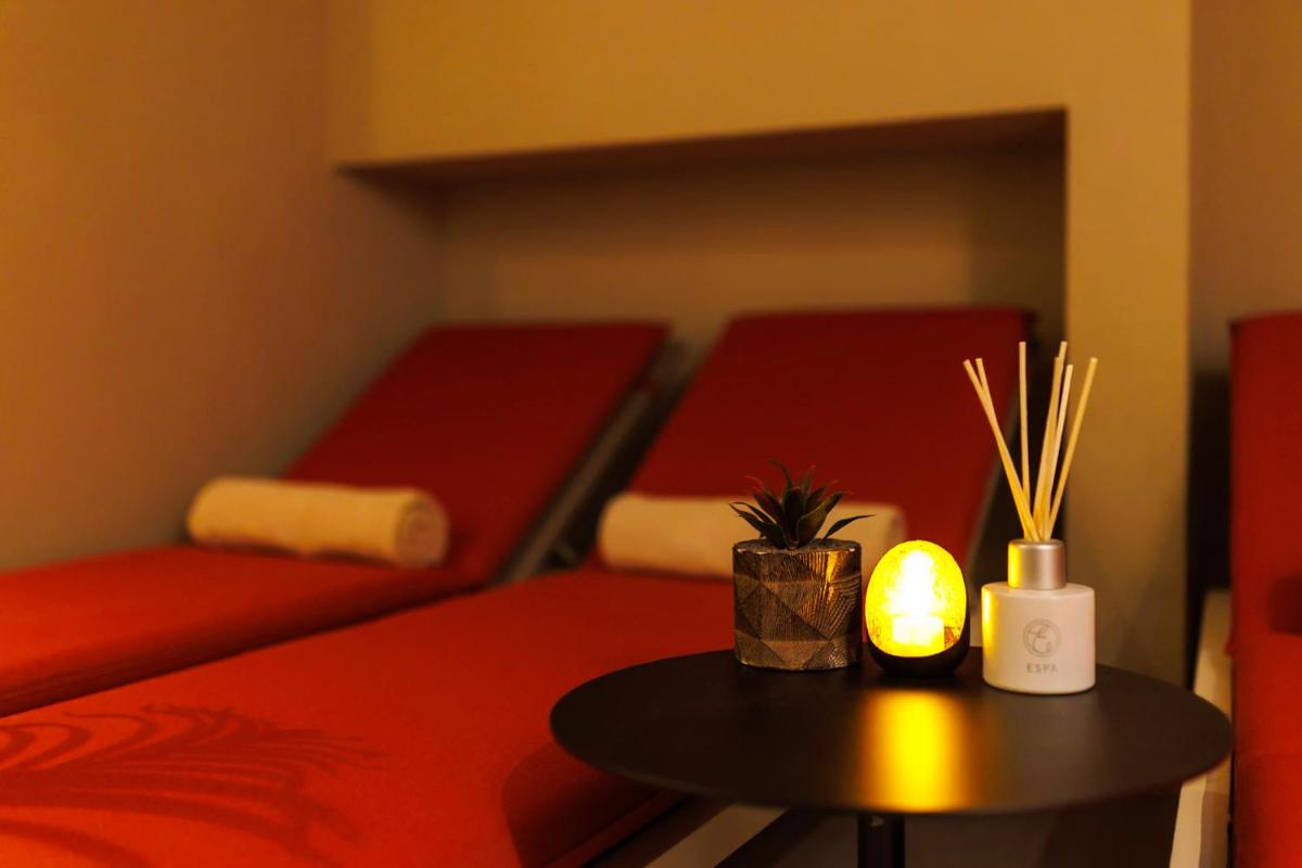Un ou plusieurs lits dans un hébergement de l'établissement Boscolo Lyon Hotel & Spa