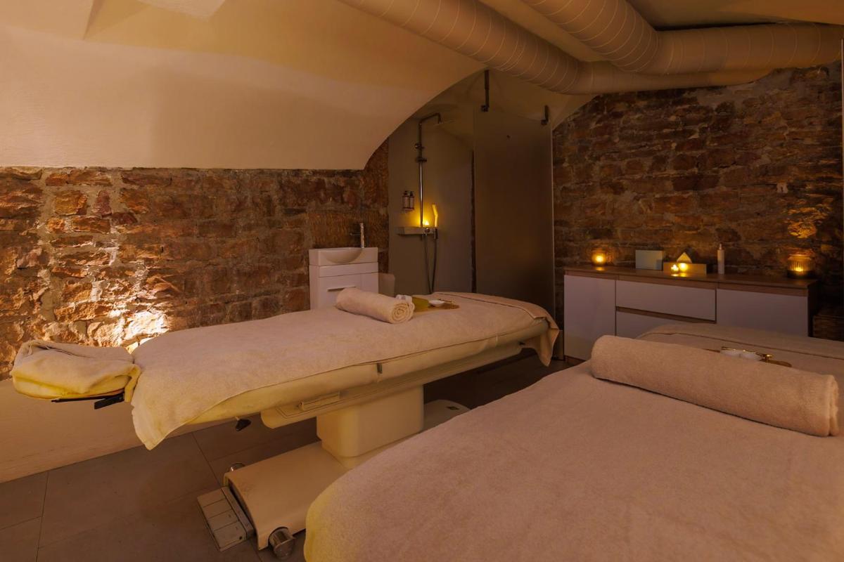 Un ou plusieurs lits dans un hébergement de l'établissement Boscolo Lyon Hotel & Spa