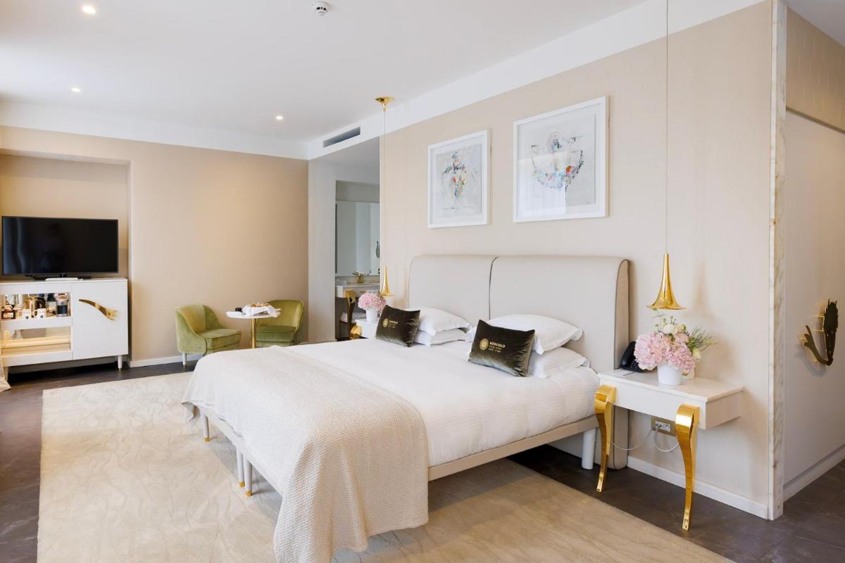 Un ou plusieurs lits dans un hébergement de l'établissement Boscolo Lyon Hotel & Spa