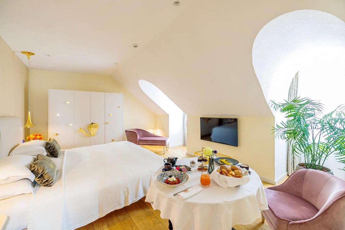 Un ou plusieurs lits dans un hébergement de l'établissement Boscolo Lyon Hotel & Spa