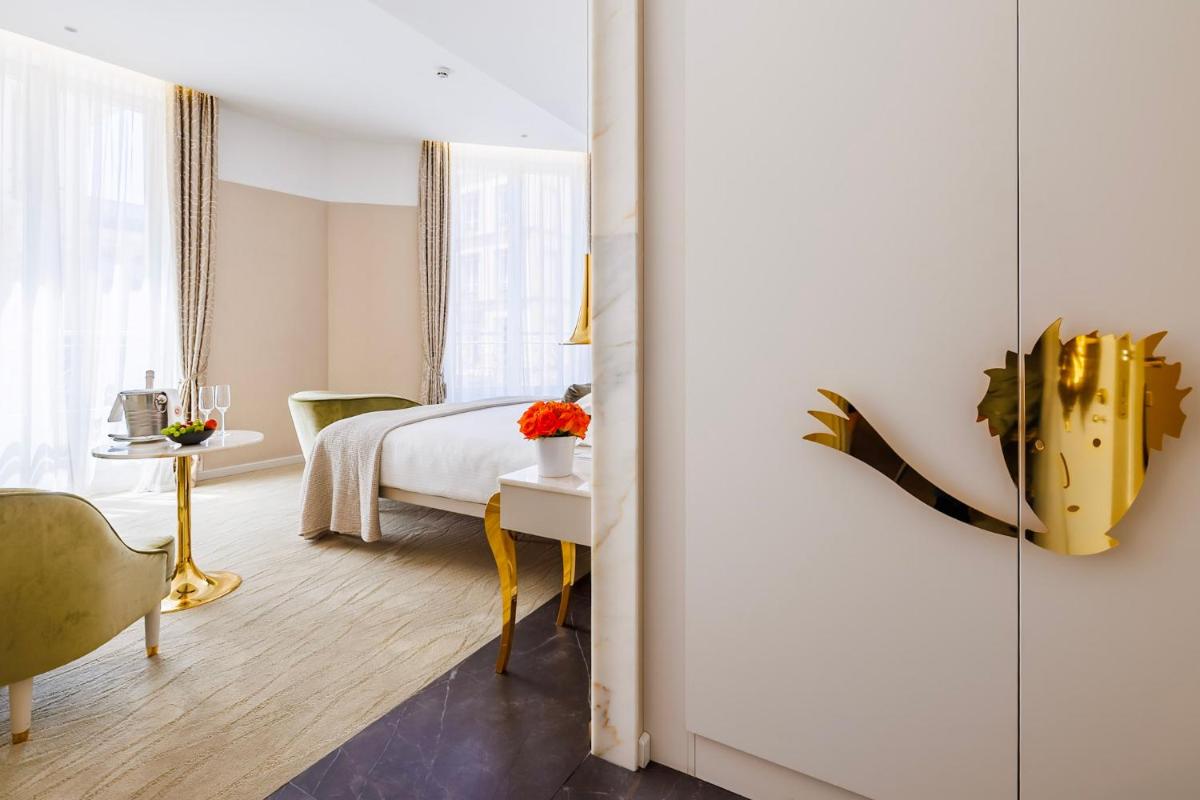 Un ou plusieurs lits dans un hébergement de l'établissement Boscolo Lyon Hotel & Spa