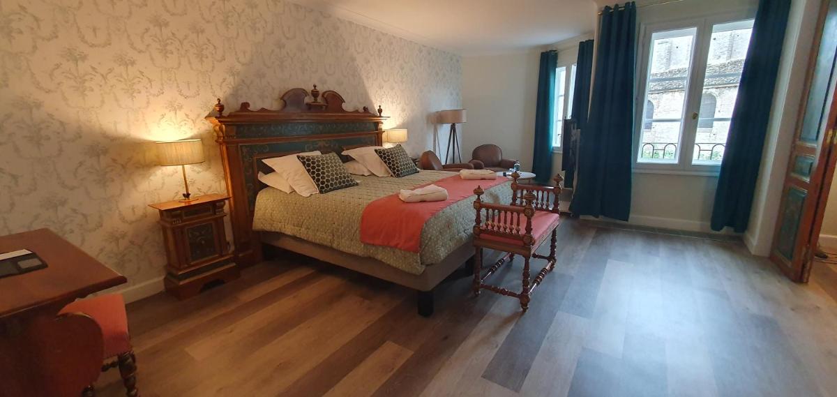 Un ou plusieurs lits dans un hébergement de l'établissement Demeures & Châteaux - Hôtel Greuze & Spa Tournus