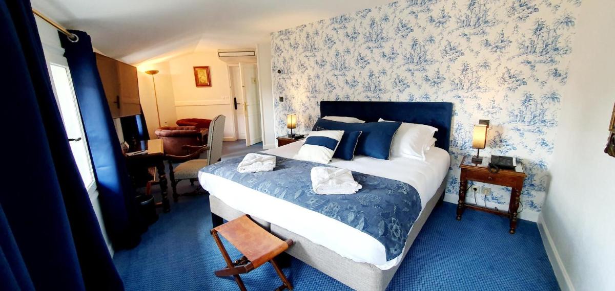Un ou plusieurs lits dans un hébergement de l'établissement Demeures & Châteaux - Hôtel Greuze & Spa Tournus