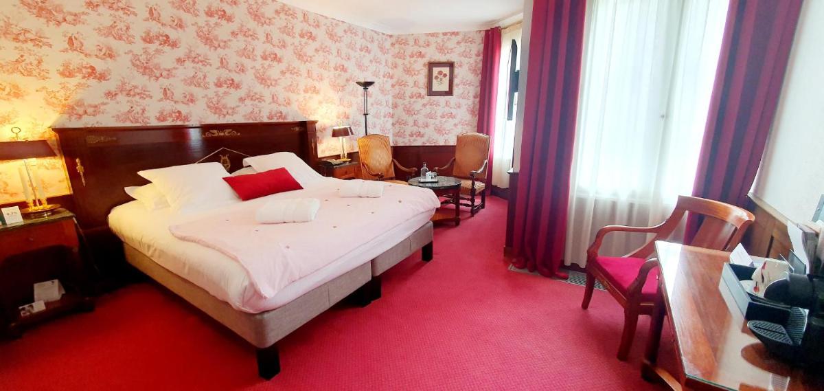 Un ou plusieurs lits dans un hébergement de l'établissement Demeures & Châteaux - Hôtel Greuze & Spa Tournus