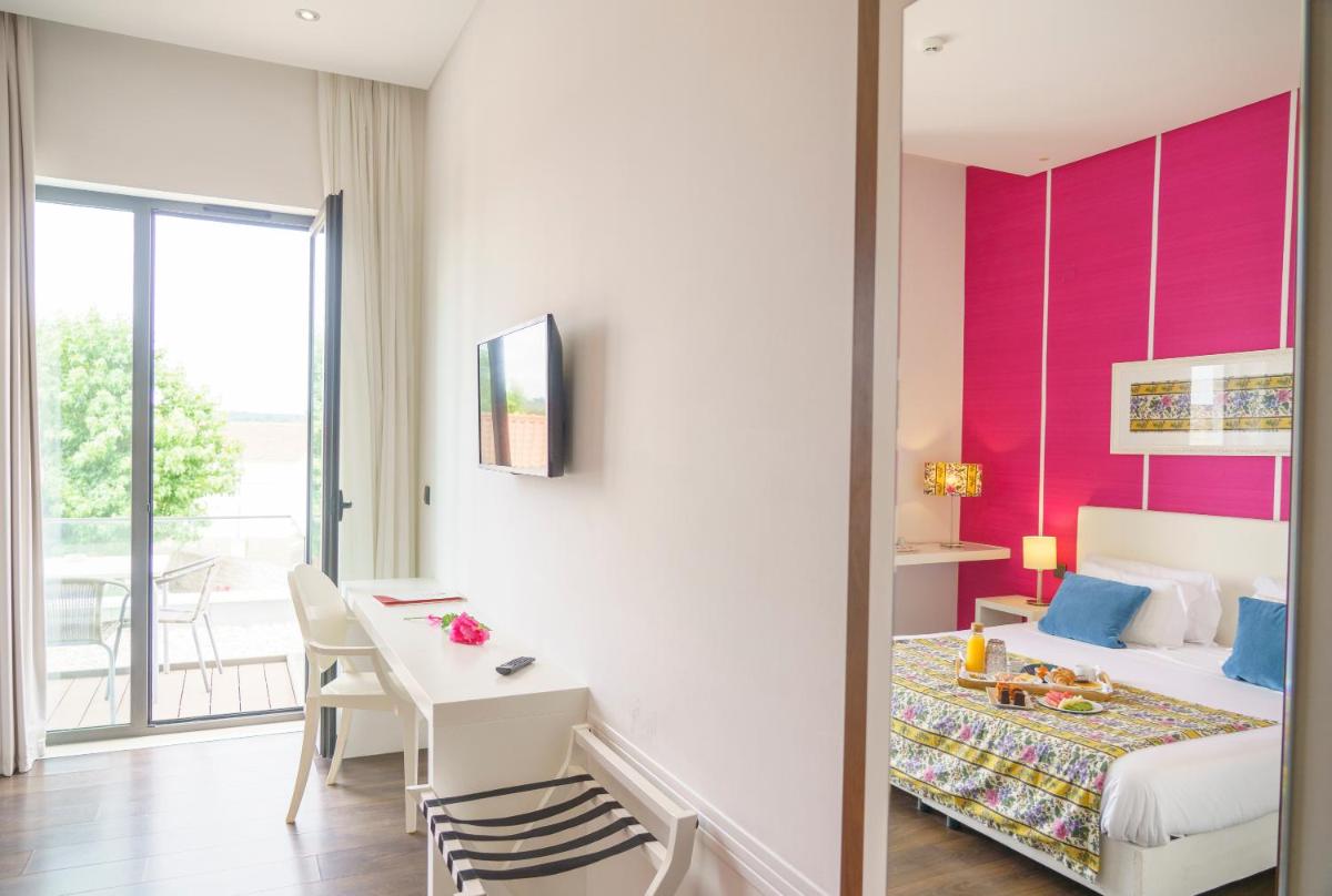 Uma cama ou camas num quarto em Real Abadia, Congress & Spa Hotel