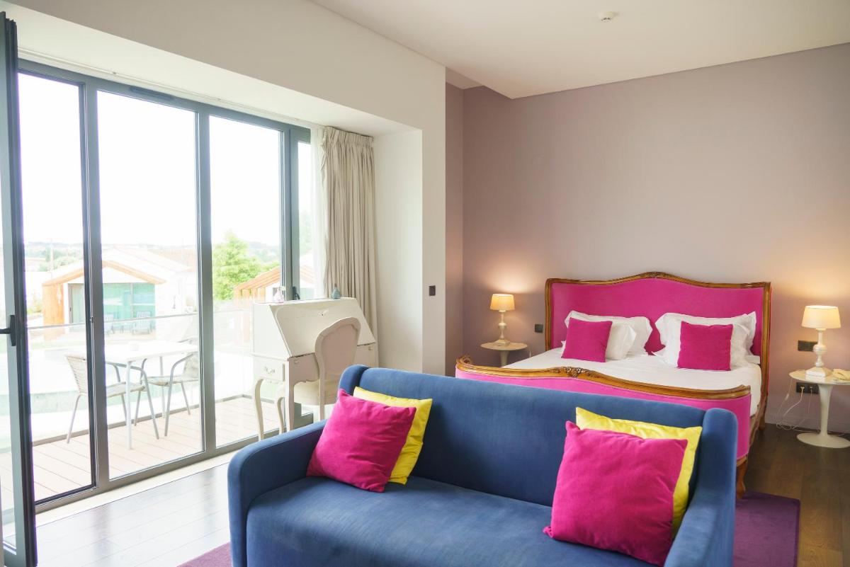 Uma cama ou camas num quarto em Real Abadia, Congress & Spa Hotel