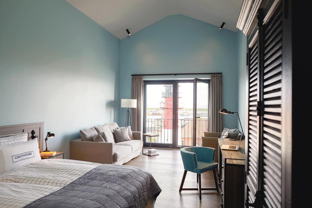 Ein Bett oder Betten in einem Zimmer der Unterkunft Lighthouse Hotel & Spa