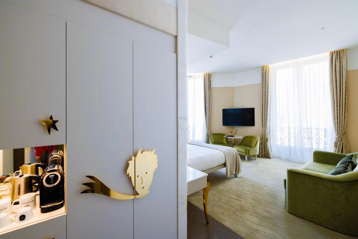 Télévision ou salle de divertissement dans l'établissement Boscolo Lyon Hotel & Spa