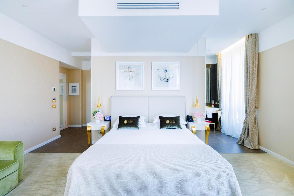 Un ou plusieurs lits dans un hébergement de l'établissement Boscolo Lyon Hotel & Spa