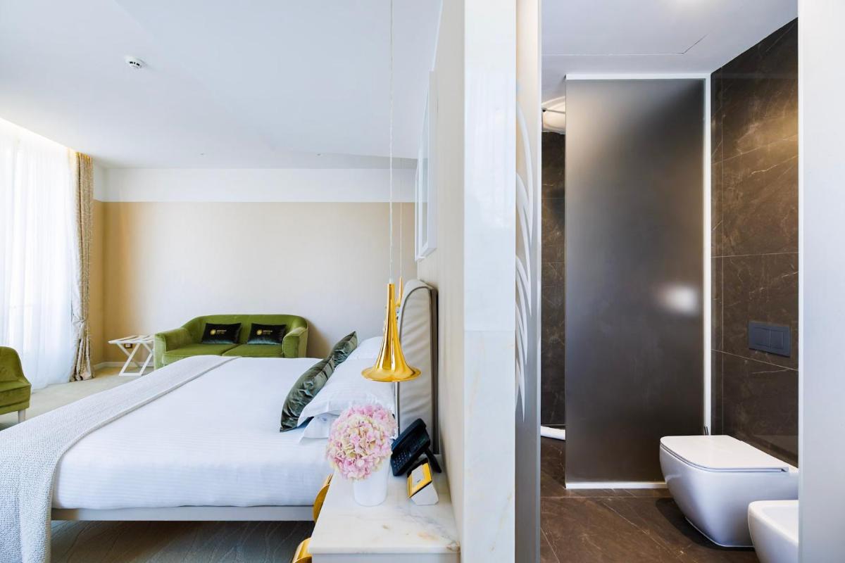 Un ou plusieurs lits dans un hébergement de l'établissement Boscolo Lyon Hotel & Spa