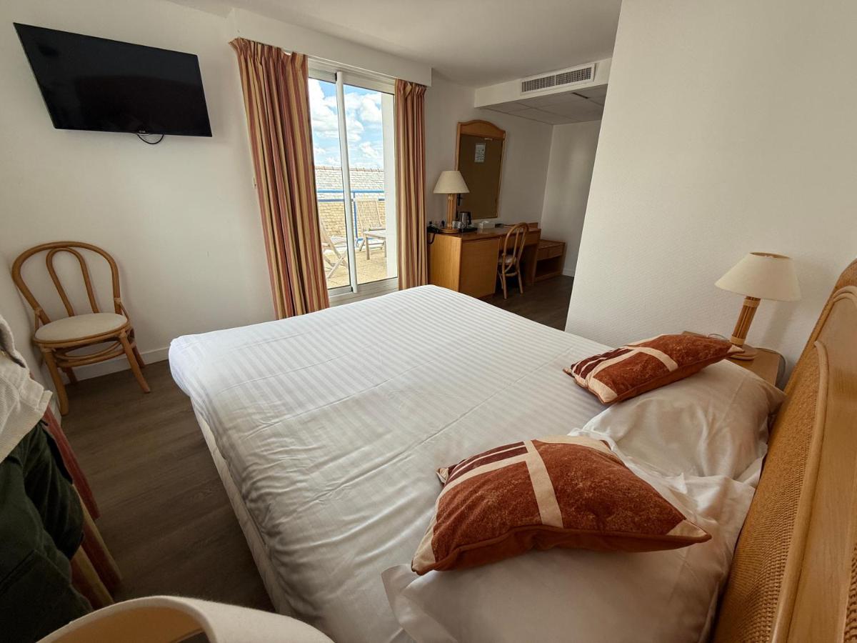 Un ou plusieurs lits dans un hébergement de l'établissement Hôtel Édenia - Spa Estime&Sens