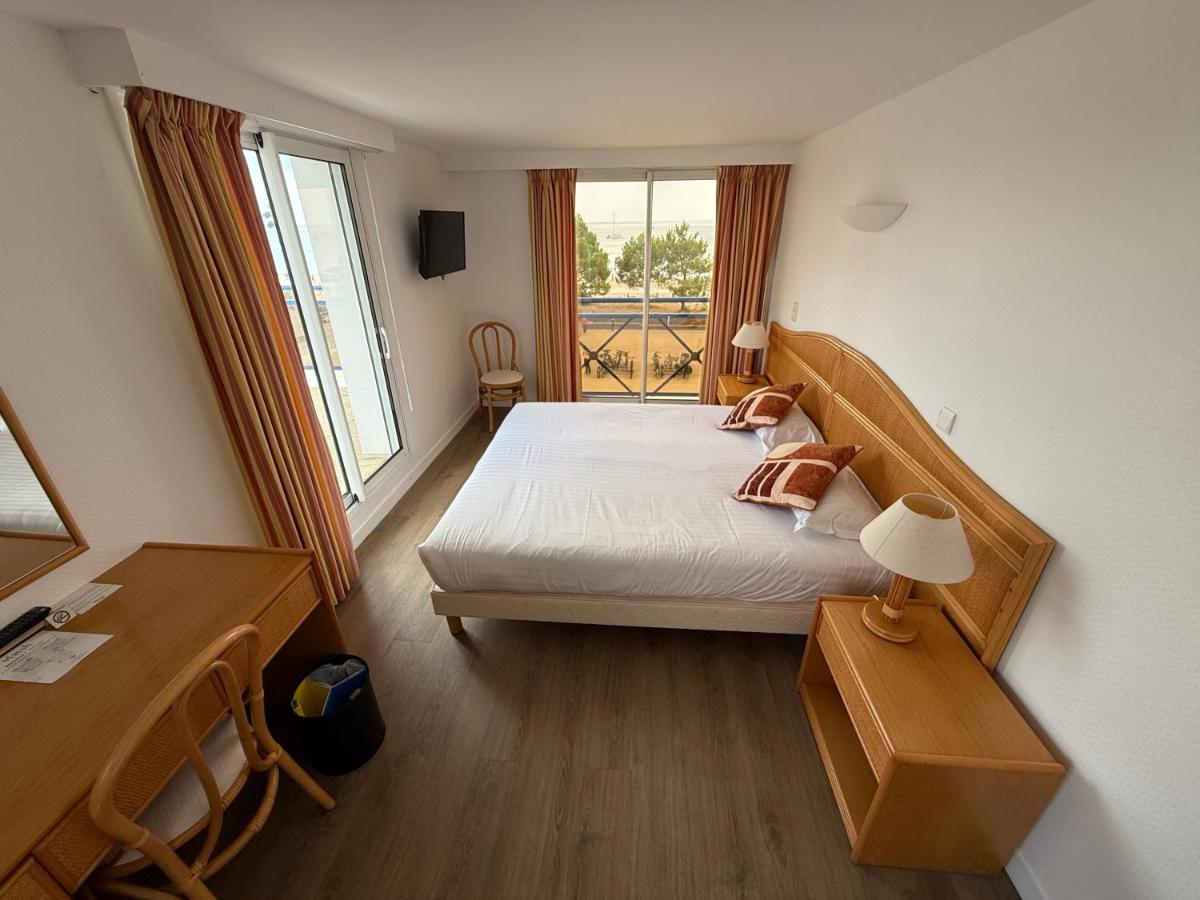 Un ou plusieurs lits dans un hébergement de l'établissement Hôtel Édenia - Spa Estime&Sens