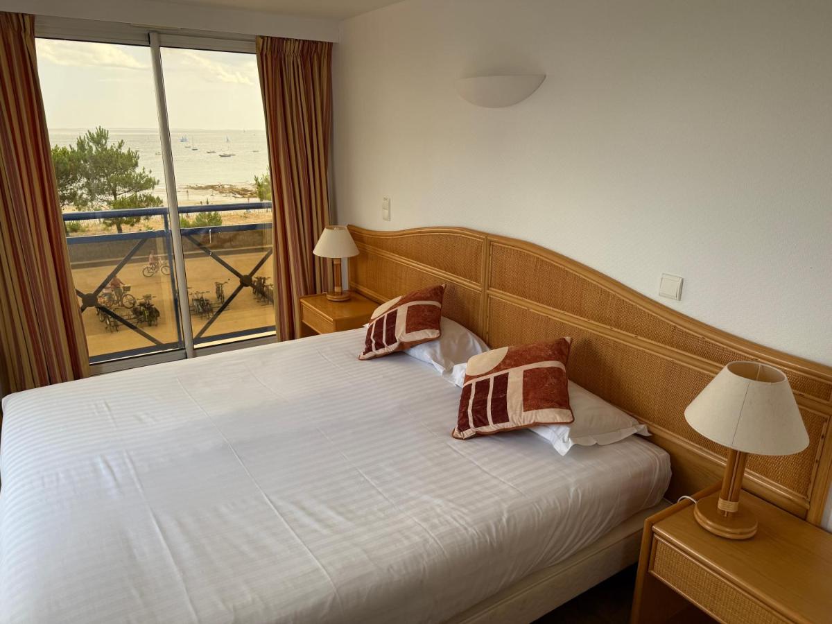 Un ou plusieurs lits dans un hébergement de l'établissement Hôtel Édenia - Spa Estime&Sens