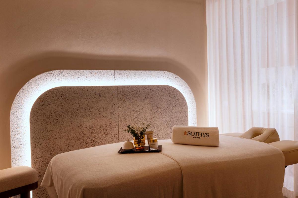 Un ou plusieurs lits dans un hébergement de l'établissement Belinda Hôtel & Spa