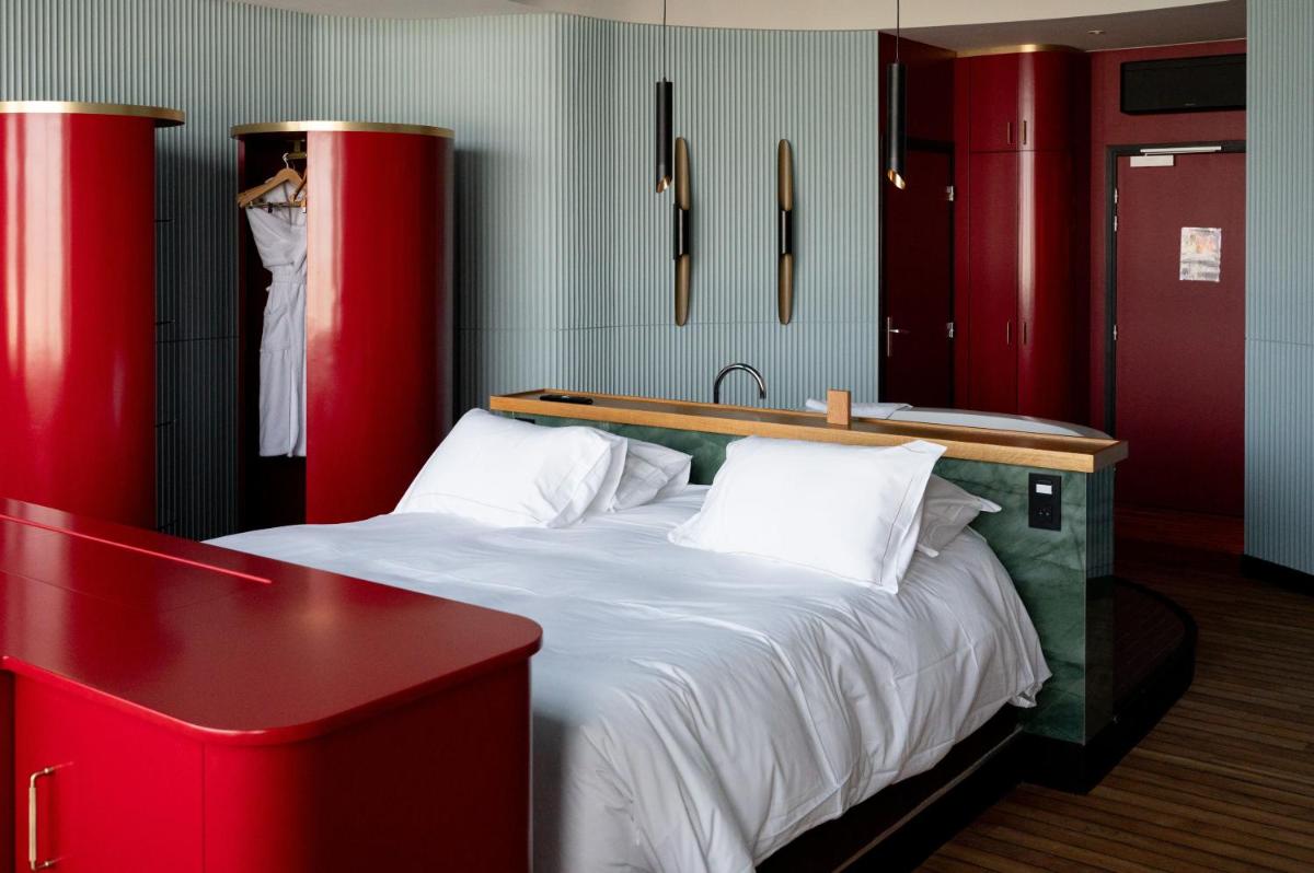 Un ou plusieurs lits dans un hébergement de l'établissement Hotel Atlantic