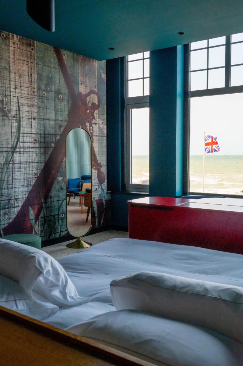 Un ou plusieurs lits dans un hébergement de l'établissement Hotel Atlantic