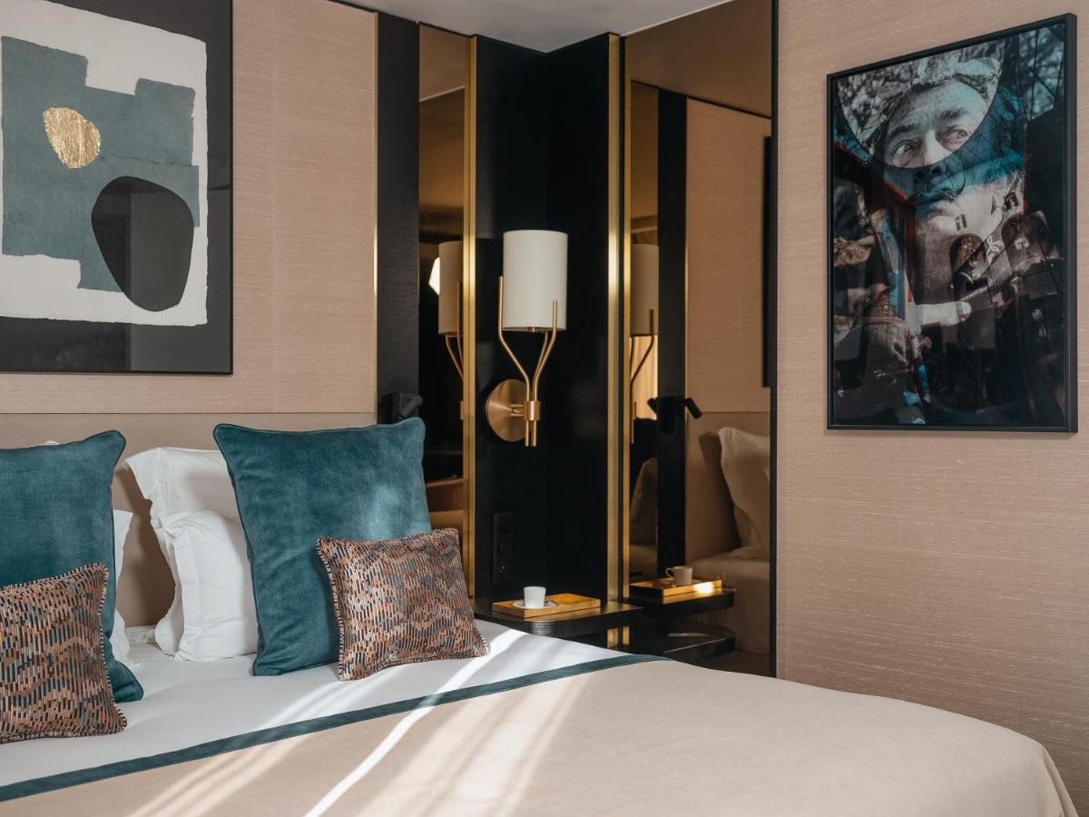 Un ou plusieurs lits dans un hébergement de l'établissement Hôtel Barnett Paris