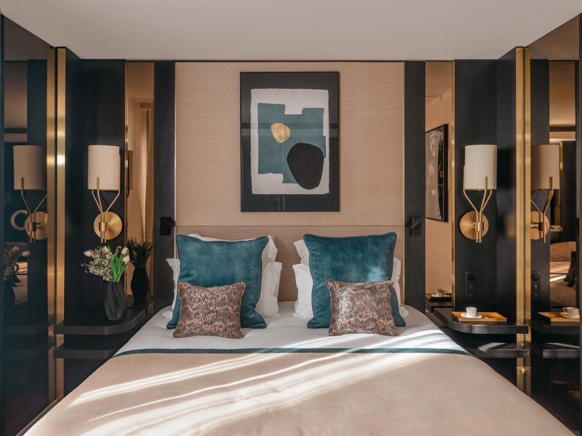 Un ou plusieurs lits dans un hébergement de l'établissement Hôtel Barnett Paris