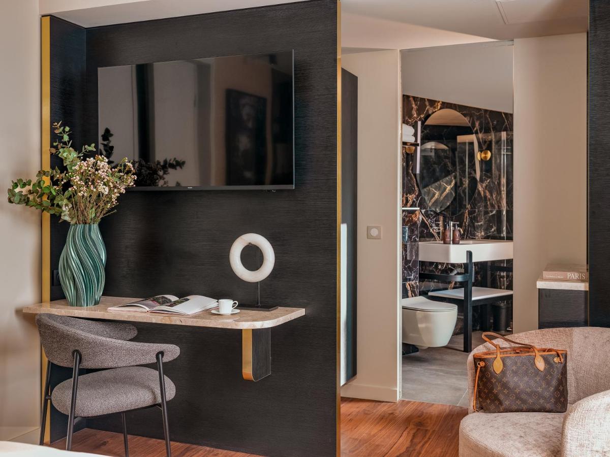Coin salon dans l'établissement Hôtel Barnett Paris